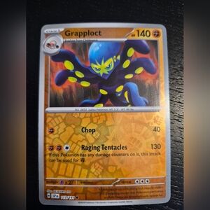 Pokemon Grapploct Card - Blue, Purple & Yellow